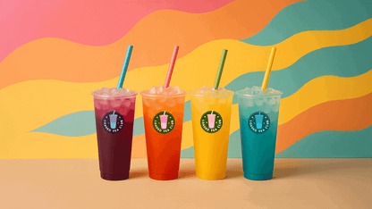 Four colorful loaded tea beverages in vibrant cups with ice against a bright, wavy background.